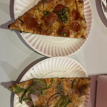 Pizza Tascio - two slices of pizza on paper plates - Pizza Near Me - Kansas City, Missouri Pizza Tascio - two slices of pizza on paper plates - Pizza Near Me - Kansas City, Missouri