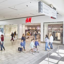 South Plains Mall - Shoppers walk past H&M inside South Plains Mall.