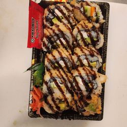 Slice n Spice - Godzilla roll. Cooked tuna, salmon, avocado, kani, cucumber with spicy mayo, sweet sauce.