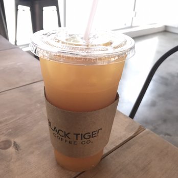 Black Tiger Coffee - Large peach earl grey iced tea ($3.75) - Coffee & Tea Near Me - Surrey, British Columbia