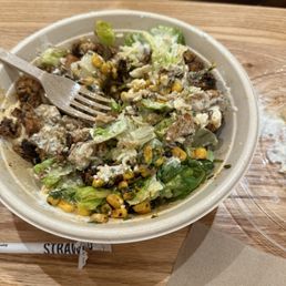 Grilled Chicken, saffron basmati rice, lettuce, fire roasted corn, hummus, tzatziki sauce and feta