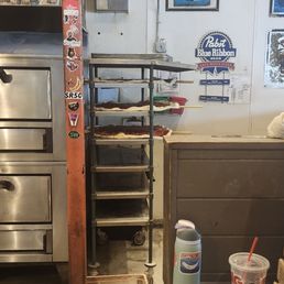 Holy moly! Ginormous pizza. That sauce bin on the ground is probably used up and bound for the dishwasher, but not a great look Holy moly! Ginormous pizza. That sauce bin on the ground is probably used up and bound for the dishwasher, but not a great look