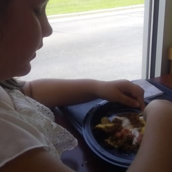 Taco Bell - My baby eating her nacho bell grande. - Fast Food Near Me - Wichita, Kansas