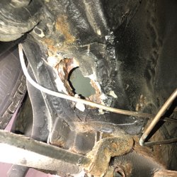Town And Country Auto Sales - The rust hole in the car after the putty was pulled out from my mechanic.