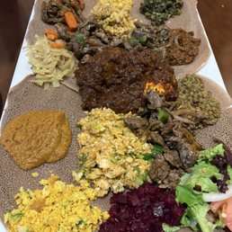 Mild Lega Beef Tibs, Doro Wot, fish and mixed vegetables Mild Lega Beef Tibs, Doro Wot, fish and mixed vegetables
