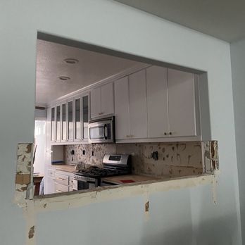 JC Tiles - Before wall patch - Flooring Near Me