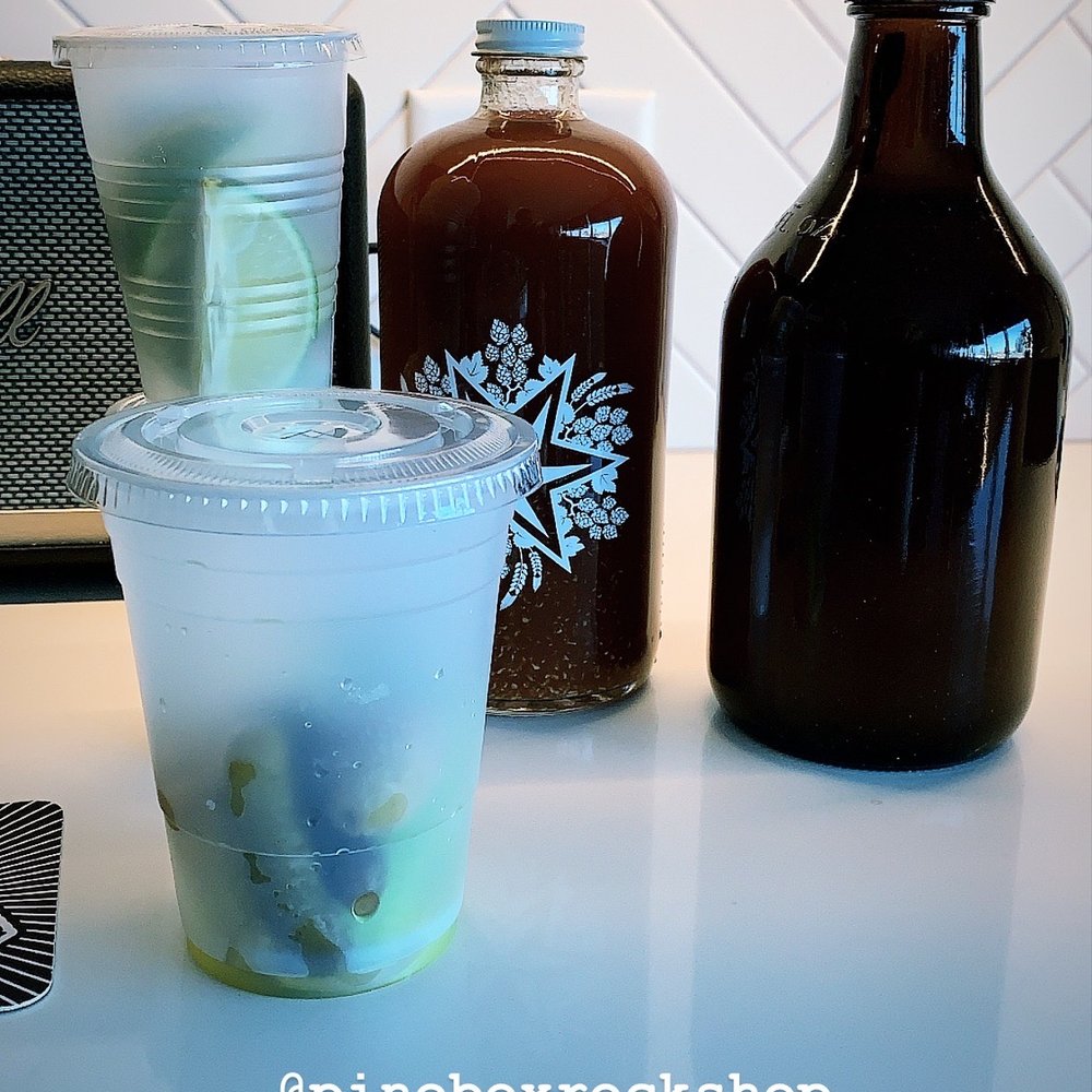 Pine Box Rock Shop - a cup of liquid and a bottle of syrup - Vegan Near Me - Brooklyn, New York Pine Box Rock Shop - a cup of liquid and a bottle of syrup - Vegan Near Me - Brooklyn, New York