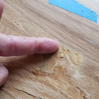 TGR General Construction - Big gouge in the new floor. Filler was added. 3 days later I could use a fingernail to scratch the patch out. - General Contractors Near Me - Tigard, Oregon