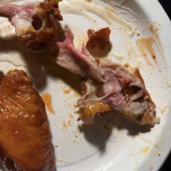 Wing It Los Angeles - Chicken wings that appear to not be fully cooked. - Chicken Wings Near Me - Los Angeles, California
