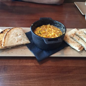 Mash'D - Corn and cheese dip with grilled pita bread. Absolutely amazing. Ask for extra pita! - New American Near Me - Frisco, Texas