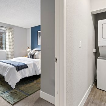 Irwin Park - Bedroom and washing machine - Apartments Near Me - Kent, Washington Irwin Park - Bedroom and washing machine - Apartments Near Me - Kent, Washington