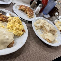 L to R: country fried steak, eggs, potatoes. Pancakes & homemade biscuits and gravy. over easy eggs, bacon, and potatoes.
