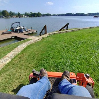 Two Bro's Lawnscaping - a person sitting on a lawn mower - Lawn Services Near Me Two Bro's Lawnscaping - a person sitting on a lawn mower - Lawn Services Near Me