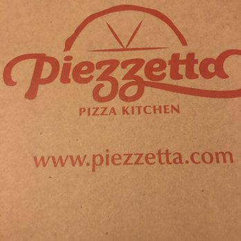 Piezzetta Pizza - a pizza box on a table - Pizza Near Me - Baltimore, Maryland