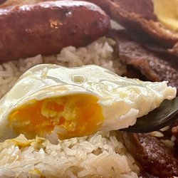 Parrilla y Sabores Rest - Egg in Bandeja Paisa more like medium to over hard vs over easy
