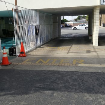 Grand Inn - The pool area, you have to cross the entrance for the cars so be careful - Hotels Near Me - Fullerton, California Grand Inn - The pool area, you have to cross the entrance for the cars so be careful - Hotels Near Me - Fullerton, California