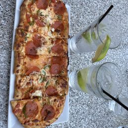Happy hour pizza - pepperoni and jalapeño.