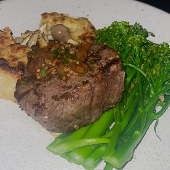The Banyan Tree - Filet, mushrooms, an inverted scalloped potato, and a topping of garlic/tomato/etc. - Seafood Near Me - Kapalua, Hawaii The Banyan Tree - Filet, mushrooms, an inverted scalloped potato, and a topping of garlic/tomato/etc. - Seafood Near Me - Kapalua, Hawaii
