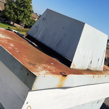 VenturaCo Chimney Pros - BEFORE--rusted and damaged chase cover and shroud - Chimney Sweeps Near Me