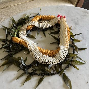 Queen Emma Summer Palace - Several leis on a small table. - Museums Near Me - Honolulu, Hawaii Queen Emma Summer Palace - Several leis on a small table. - Museums Near Me - Honolulu, Hawaii