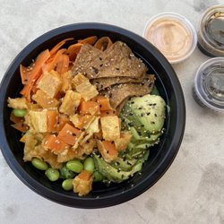 Salad with tempura sweet potato, tofu skins, avocado and veggies.