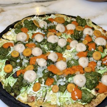 Quetzal - tlayuda toluquena - chorizo verde, white coco bean, queso chihuahua, carrot escabeche, - Mexican Near Me - Toronto, Ontario