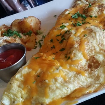 Risotto - Beef, bacon, and cheddar omelet (side of parmesan home fries) - Mediterranean Near Me - Albany, New York Risotto - Beef, bacon, and cheddar omelet (side of parmesan home fries) - Mediterranean Near Me - Albany, New York