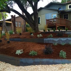 YardFarm - This is an ambitious steel retaining wall project with some delightful native plants/