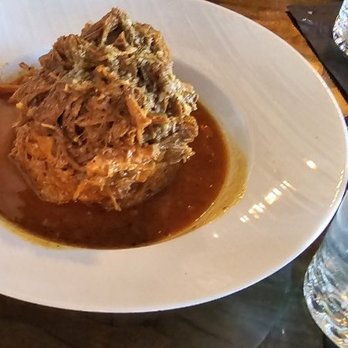 Spice House - Monfongo with Pork, Hand mashed fried green plantain, and Garlic Mojo - Caribbean Near Me - Duluth, Georgia