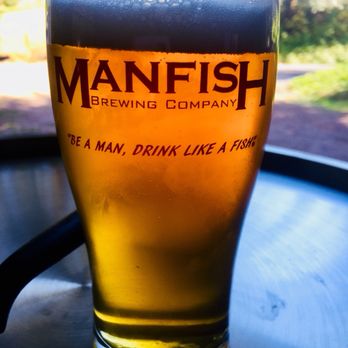 Manfish Brewing - a pint of beer on a table - Breweries Near Me - Issaquah, Washington Manfish Brewing - a pint of beer on a table - Breweries Near Me - Issaquah, Washington