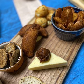 Tasca Tasca - a variety of food on a cutting board - Wine Bars Near Me - Sonoma, California