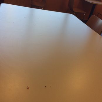 Dunkin' - a table and chairs in a restaurant - Donuts Near Me - Quincy, Illinois Dunkin' - a table and chairs in a restaurant - Donuts Near Me - Quincy, Illinois