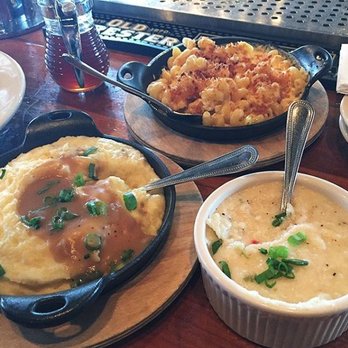 The Eagle Mass Ave - L to R: Horseradish mashed potatoes, mac & cheese, white cheddar grits (with hot honey in the background) - American Near Me - Indianapolis, Indiana The Eagle Mass Ave - L to R: Horseradish mashed potatoes, mac & cheese, white cheddar grits (with hot honey in the background) - American Near Me - Indianapolis, Indiana