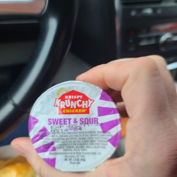 Krispy Krunchy Chicken - a person holding a container of sweet and sour - Chicken Shop Near Me - Sharonville, Ohio Krispy Krunchy Chicken - a person holding a container of sweet and sour - Chicken Shop Near Me - Sharonville, Ohio