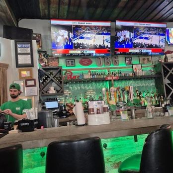 Ouachita Bar & Grill - OBG bar area decked out in green. Did I mention the parade will traipse right down Central? - Barbeque Near Me - Hot Springs, Arkansas