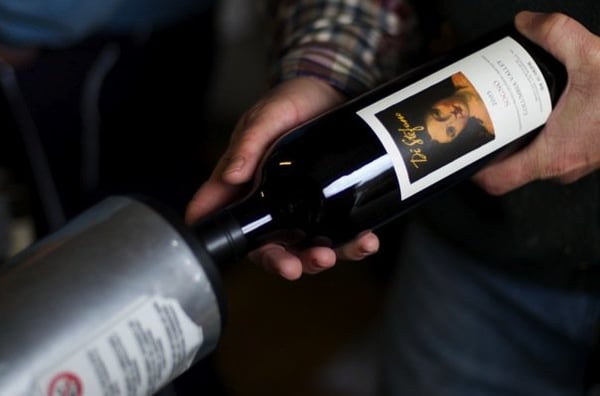 Photo of Distefano Winery - Woodinville, WA, US. a bottle of wine being poured