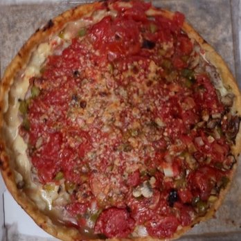 Lou Malnati's Pizzeria - After I spread the sauce across the pizza. - Pizza Near Me - Oak Lawn, Illinois Lou Malnati's Pizzeria - After I spread the sauce across the pizza. - Pizza Near Me - Oak Lawn, Illinois