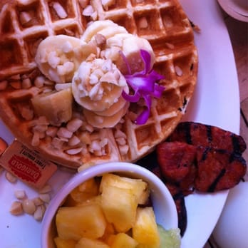 Island Lava Java - Belgian waffles topped with bananas and macadamia nuts. Side of Portuguese sausage and fruit. - American Near Me - Kailua Kona, Hawaii