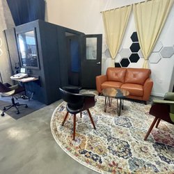 Greentree Hearing Aid Center - Soundproof booth for hearing examinations; well-appointed waiting area.
