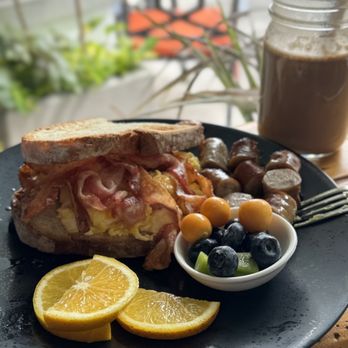 Sunny Eggs - Toast with eggs bacon and sausage on the side - Juice Bars & Smoothies Near Me - Key West, Florida