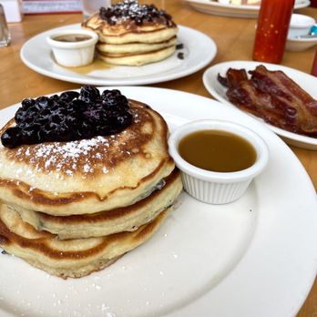 Clinton St. Baking - Blueberry pancakes in front, Sugar Cured Bacon on side, chocolate chip pancakes in back - Bakeries Near Me - New York, New York