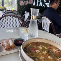 Tom yum soup and fried veggie rolls Tom yum soup and fried veggie rolls