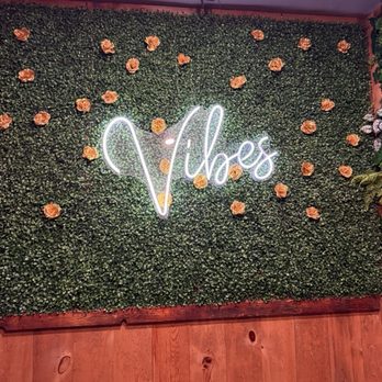 Vibes Kitchen & Bar - The selfie wall as you enter the restaurant/bar. - New American Near Me - Des Moines, Iowa