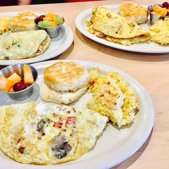 The Toasted Yolk Cafe - Three omelettes w/ hashbrown casserole, a biscuit and some fruit. Hashbrown casserole is a must! - Breakfast & Brunch Near Me - Spring, Texas The Toasted Yolk Cafe - Three omelettes w/ hashbrown casserole, a biscuit and some fruit. Hashbrown casserole is a must! - Breakfast & Brunch Near Me - Spring, Texas