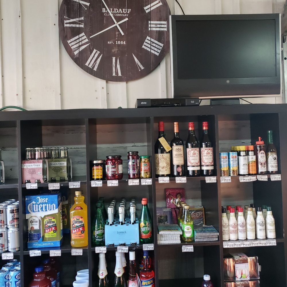 Red Barn Package - a large clock on the wall - Beer, Wine & Spirits Near Me - Cumming, Georgia Red Barn Package - a large clock on the wall - Beer, Wine & Spirits Near Me - Cumming, Georgia