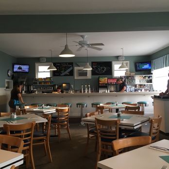 Wally's - The counter with their winning banner from the Jazzy scallop and seafood festival. Great place. - New American Near Me - Surf City, New Jersey