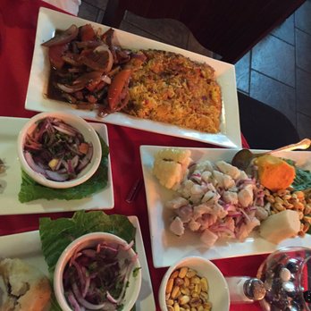 Machu Picchu - Lomo saltado tacu tacu and ceviche in the center right - Peruvian Near Me - Pineville, North Carolina