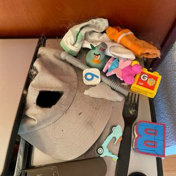 Do No Chores - Things I had to take back out of the trash to clean myself. Toys, socks, a hat, part of our furniture. - Home Cleaning Near Me