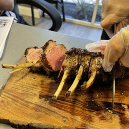 Rack of lamb. Didn't need anything more than a light butter knife to cut this. Such a wonderful cook on it and it was very flavorful. Rack of lamb. Didn't need anything more than a light butter knife to cut this. Such a wonderful cook on it and it was very flavorful.