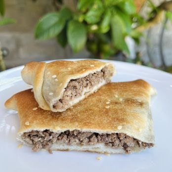 Sana'a Cafe - Meat fatayer - 7-spice ground beef, onion, olive oil, tomato - Coffee Roasteries Near Me - Oakland, California